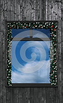 Front view of decorated window for holidays with Reflection of blue cloudy sky in