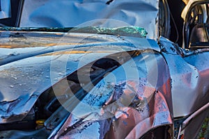 Front view of a dented car after an accident