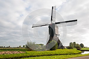 Front view Dutch windmill in autumn