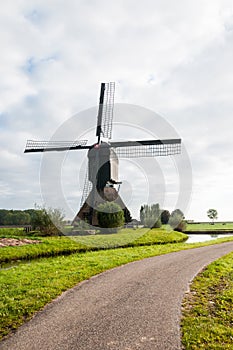 Front view Dutch windmill in autumn