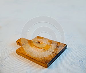 Front view of empty cutting board with space for text on wood texture background, top view