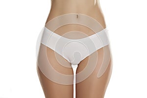 Front view of female hips with white panties