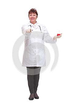 Front view of female scientist with beaker of red liquid on palm