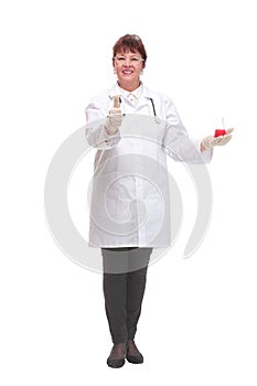Front view of female scientist with beaker of red liquid on palm