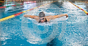 Front view of a female swimmer performing butterfly technique