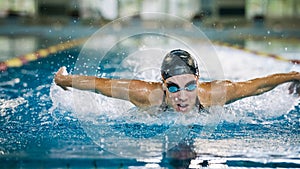 Front view of a female swimmer performing butterfly technique