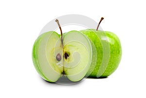Front view of fresh green apple with slice isolated on white background