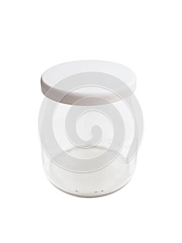 Front view of glass jar with plastic lid isolated. Empty glass yogurt jar on white background. Mini yogurt jar with lid. Kitchen