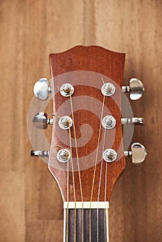 Front view of a guitar headstock. Close-up vertical image