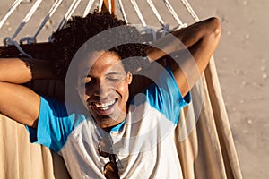 Man sleeping in a hammock on the beach