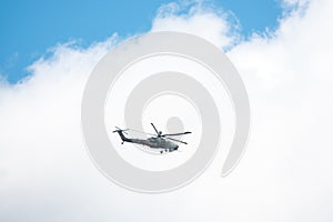 Front view of helicopter in flight. Fly over the snow mountain.