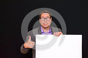 Front view image of caucasian Business man holding a blank banner shows thumb up isolated on black background