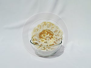 Front view indonesian round fish chips on transparent bowl