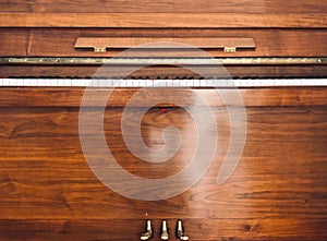 Front of a wooden piano. photo