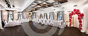 Front view at an interior of a banquet hall ready for wedding