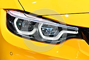 Front view of the LED headlights yellow sport car