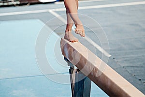 front view legs female gymnast step on balance beam in gymnastics