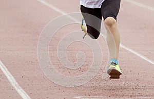Legs in motion duing a running competition photo
