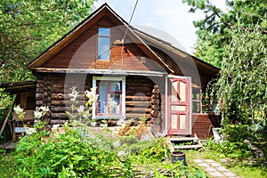Front view of log house in russian village