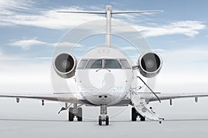 Front view of the luxury corporate aircraft with an opened gangway isolated on bright background with sky