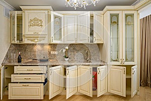 Front view of luxury modern neoclassic beige kitchen interior photo