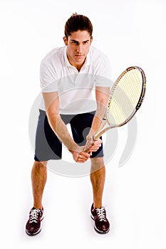 Front view of male carrying racket