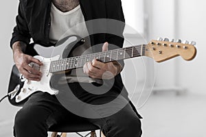 Front view male musician playing electric guitar 1. High quality and resolution beautiful photo concept