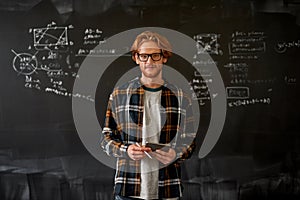 Front view of male teacher looking at camera