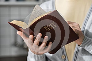 front view man holding bible. High quality photo