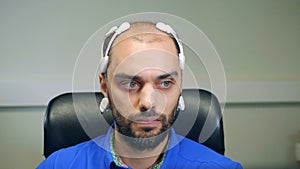 Front view of a man wearing a bio-signal EEG headset