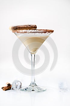 Front view of martini glass with tasty chocolate martini cocktail made from chocolate, cream and vodka, decorated with cinnamon s