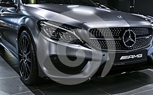 Front view of a Mercedes Benz C 43 AMG V8 Bi-Turbo 4Matic 2018. Headlight. Car exterior details.