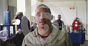 Front view of mixed race worker in factory