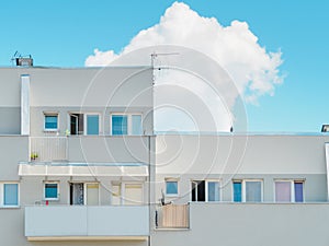 Front view of modern apartment building against blue sky in a sunny day. urban accommodation district