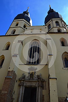 Front view of monumental gothic cathedral church of Saint Nicholas in Trnava, Western Slovakia, in spring daylight sunshine