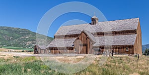 Front view of a mountain barn with blue sky