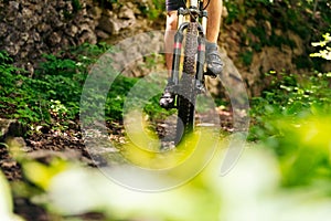 Front view of a mountain bike riding fast