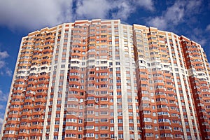 Front view of new modern multistoried residential brick building photo