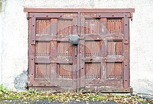 Front view of old abandoned wooden garage doors