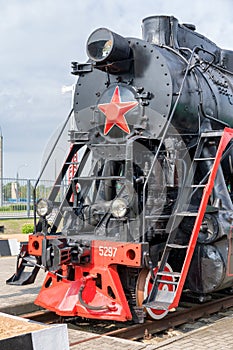 Front view of an old-fashioned steam locomotive.