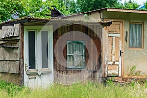 Front view of old garden sheds on sunny day