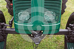 Front view of an old green tractor