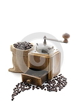 Front view of the old manual coffee wooden grinder retro, vintage style, and beans in sacks with Isolated on white backgrounds