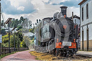 Front view of old train with dramatic sky