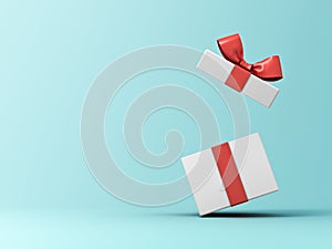 Front view of open present box or gift box with red ribbons and bow isolated on green blue pastel color background
