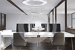 Front view of an open space office, dark