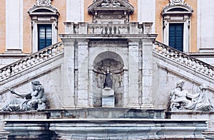 Front view of the Palazzo Senatorio Senatorial Palace and Fontana della Dea Roma in The Piazza del Campidoglio on top of the photo