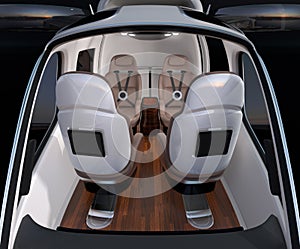 Front view of Passenger Drone interior. Front leather seats turned backward