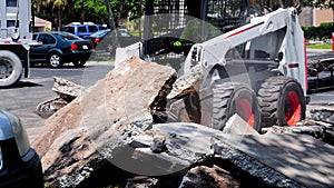 Front view of pay-loader, concrete pieces