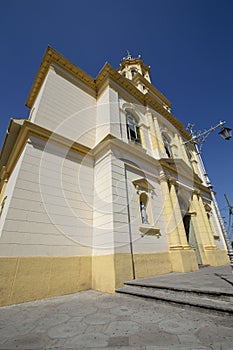 Front view in perspective of yellow church